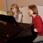 Piano Teacher teaching Piano Student Playing Chopin