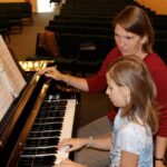 Mrs. Christy teaching Piano Lesson