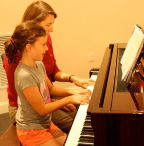 Teacher-Student Piano Duet: Play piano